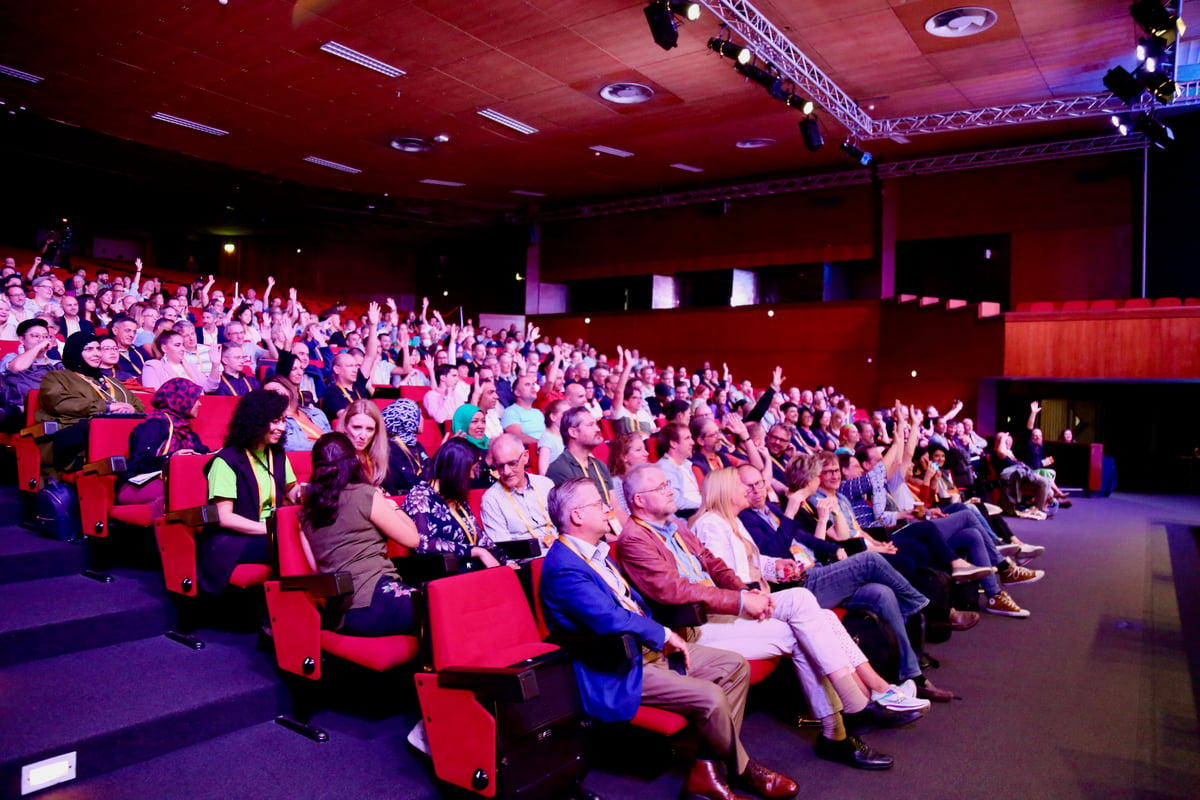 An auditorium full of changemakers in Lisbon